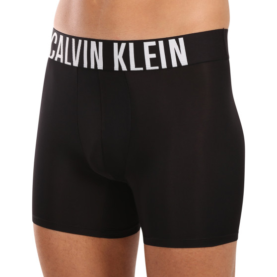 3PACK Мъжки боксерки Calvin Klein черено (NB3612A-Q1L)